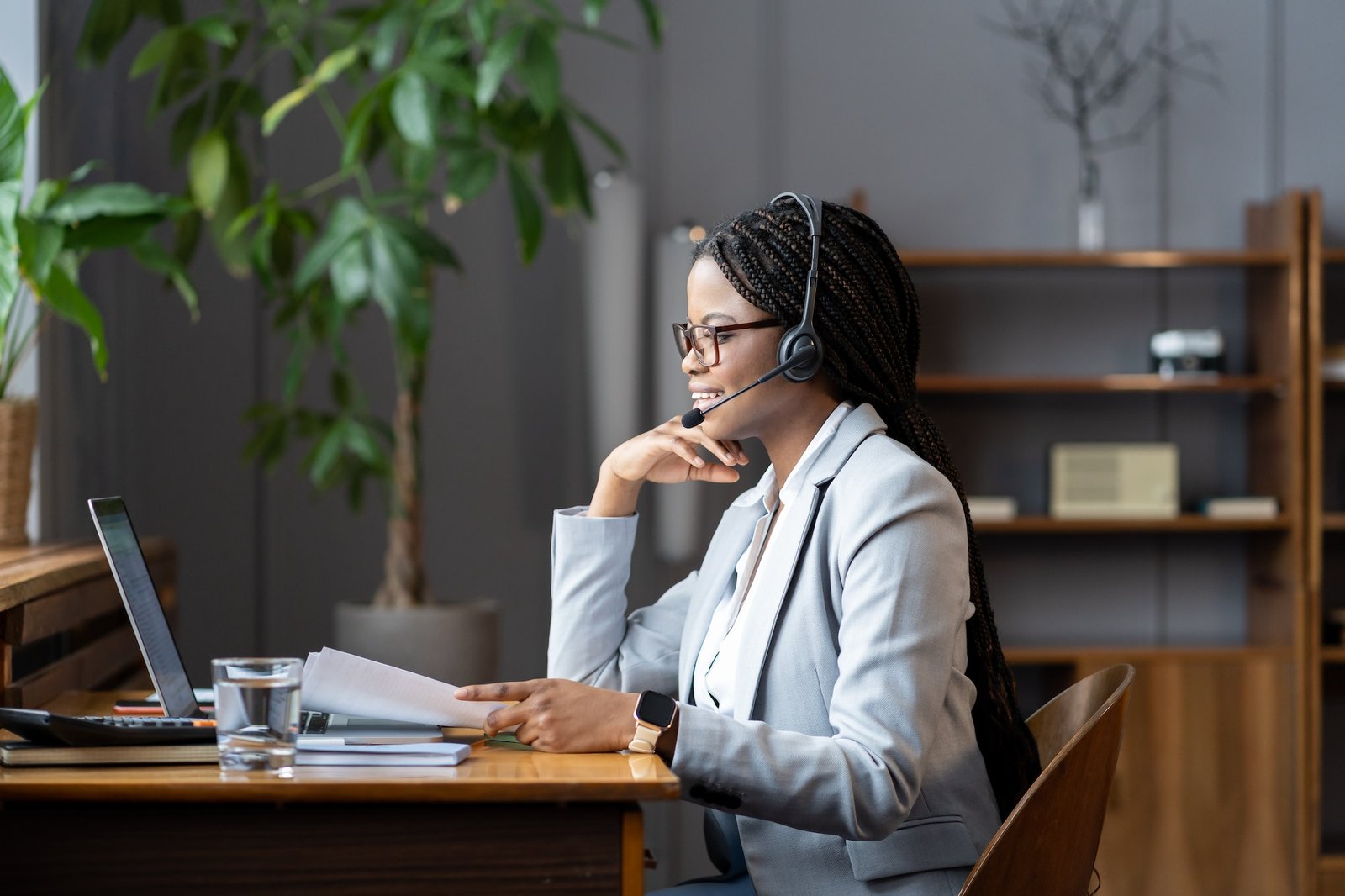 young-positive-african-woman-remote-recruiter-using-wireless-headset-to-communicate-with-candidates.jpg